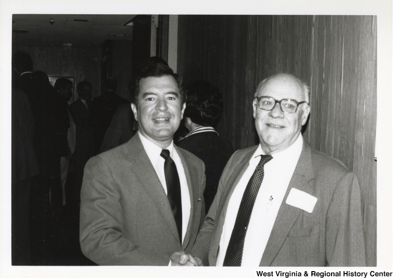 On the left, Representative Nick J. Rahall (D-W.Va.) shakes hands with historian Robert Coakley.