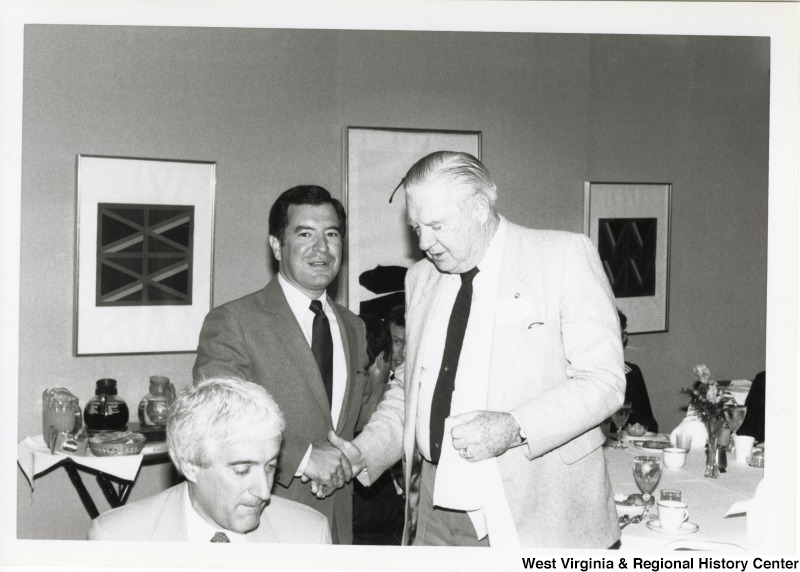 On the left, Representative Nick J. Rahall (D-W.Va.) shakes hands with Senator Jennings Randolph (D-W.Va.).