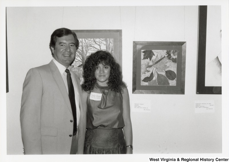 Representative Nick J. Rahall (D-W.Va.) stands with Julie Palen at the Congressional Art Competition.