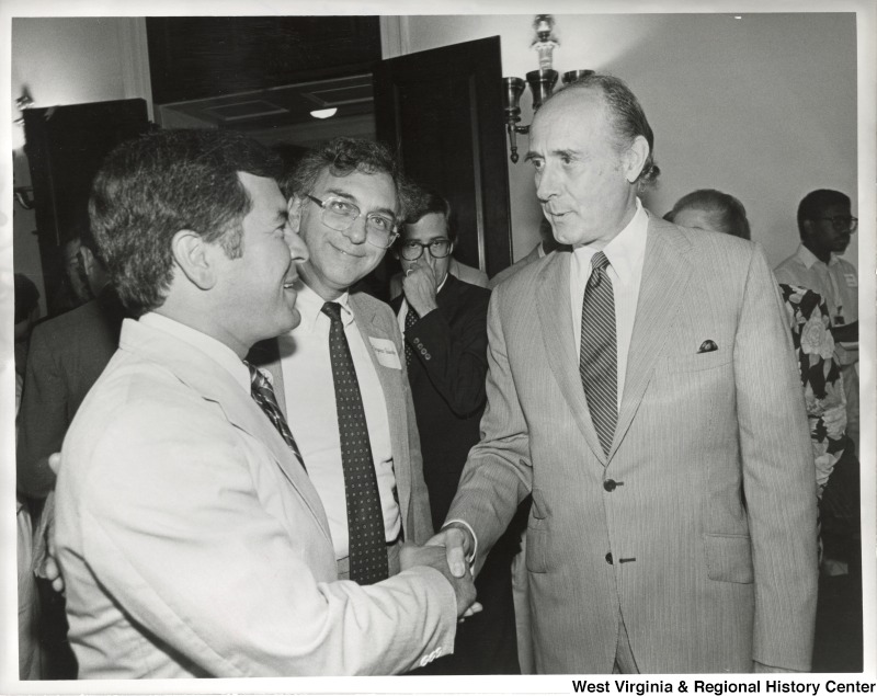 L-R: Representative Nick J. Rahall (D-W.Va.), Ben Palumbo, Henry ManciniRepresentative Rahall shakes hands with Henry Mancini at an event.