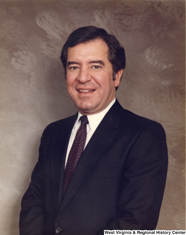 Studio portrait of Representative Nick J. Rahall (D-W.Va.) in front of a gray background.