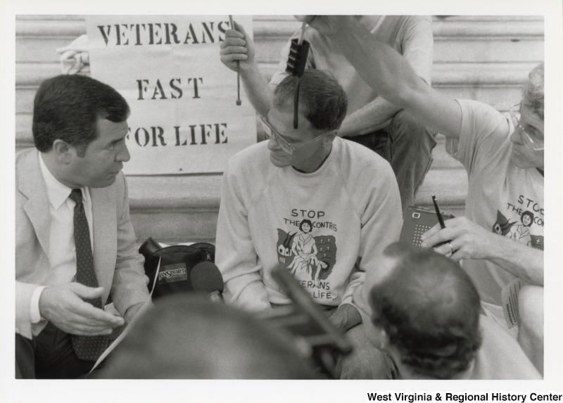 On the left, Representative Nick J. Rahall (D-W.Va.) talks with several unidentified men on the steps of the Capitol building at the Veterans Fast for Life.