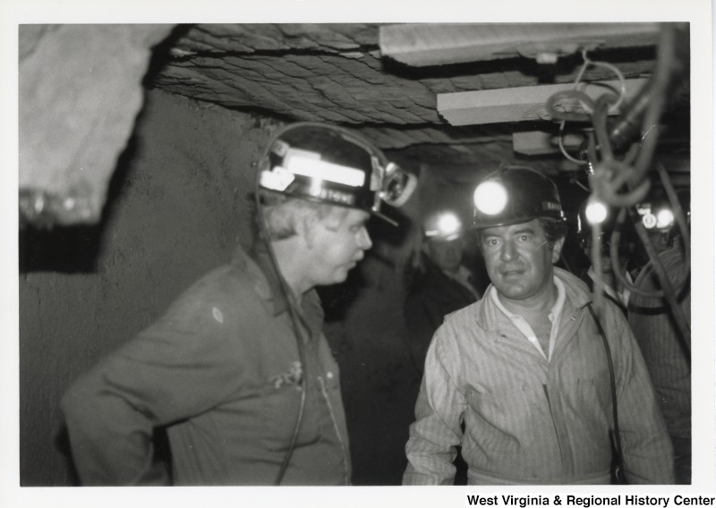 Congressman Nick Rahall dressed in a coal miner uniform inside of Old Ben Coal Mine with Bob Stone, Secretary-Treasurer of United Mine Workers of America (UMWA).