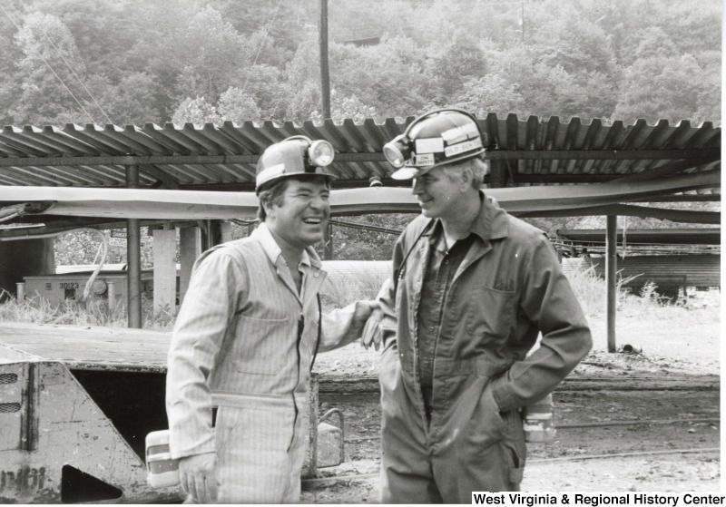 Congressman Nick Rahall dressed in a coal miner uniform at Old Ben Coal Mine with Bob Stone, Secretary-Treasurer of United Mine Workers of America (UMWA).