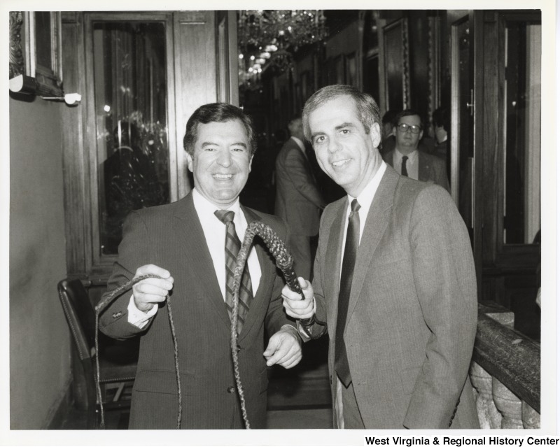 Congressmen Nick Rahall and Congressman Tony Coelho, Majority Whip, holding whips.