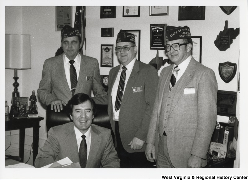 Congressman Nick Rahall with three unidentified West Virginia Veterans of Foreign Wars of the United States Members at United States Capitol Office.