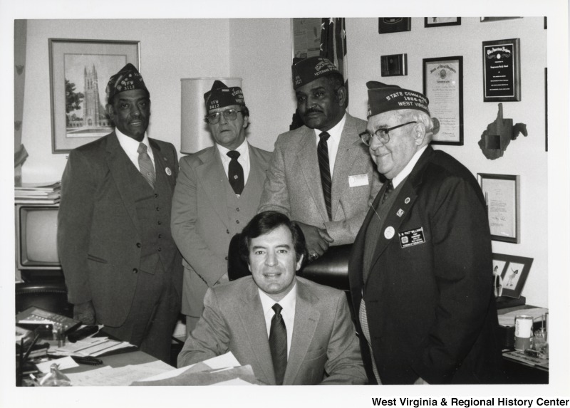 Congressman Nick Rahall with four unidentified West Virginia Veterans of Foreign Wars of the United States Members at United States Capitol Office.