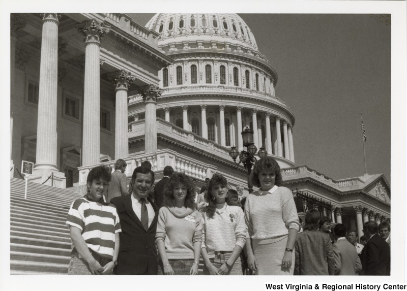 Congressman Nick Rahall with four unidentified women in front of the United States Capitol.