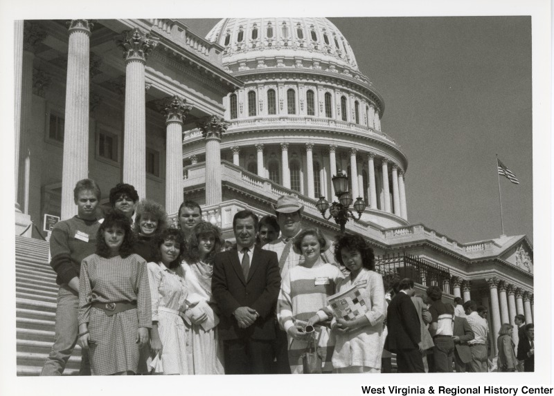 Congressman Nick Rahall with a group of unidentified people in front if the Unites States Capitol.