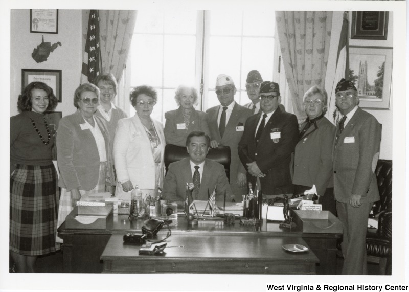 Congressman Nick Rahall with an unidentified group of American Legion members inside of his United States Capitol office.
