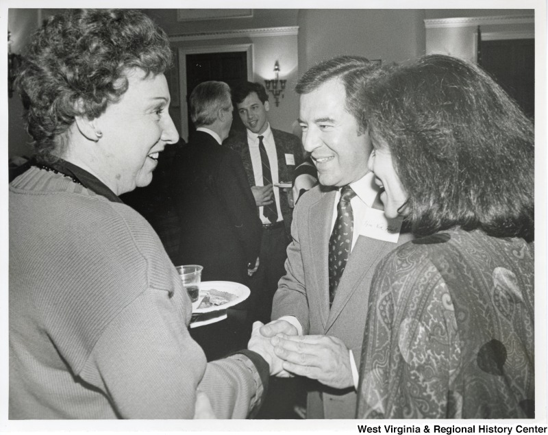 Congressman Nick Rahall speaking with Jean Stapleton, All in the Family actress, and an unidentified woman at a Congressional Arts Caucus Luncheon.