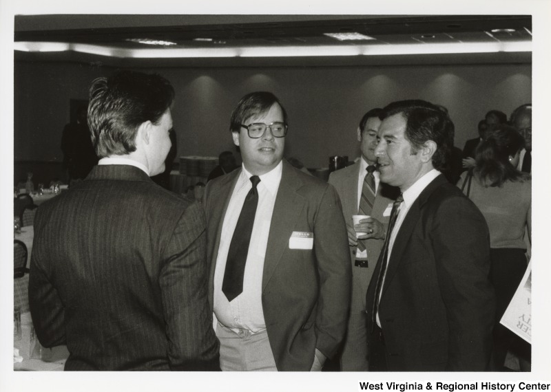 Congressman Nick Rahall talking with two unidentified men at an Economic Development Seminar in Bluefield, West Virginia.