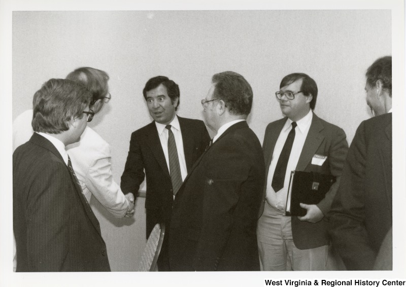 Congressman Nick Rahall with a group of unidentified men at an Economic Development Seminar in Bluefield, West Virginia.