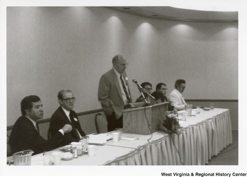 Unidentified man speaking at an Economic Development Seminar attended by Congressman Nick Rahall in Bluefield, West Virginia.