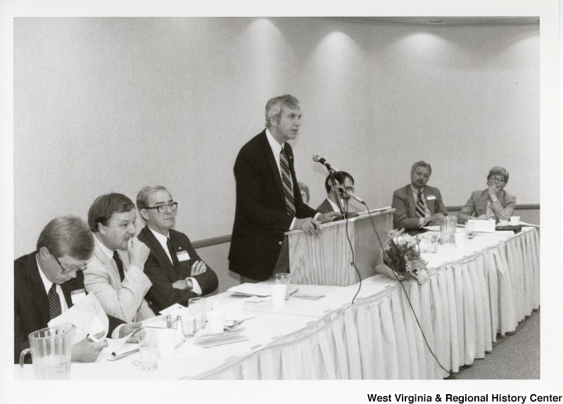 An unidentified man speaking at an Economic Development Seminar attended by Congressman Nick Rahall in Bluefield, West Virginia.