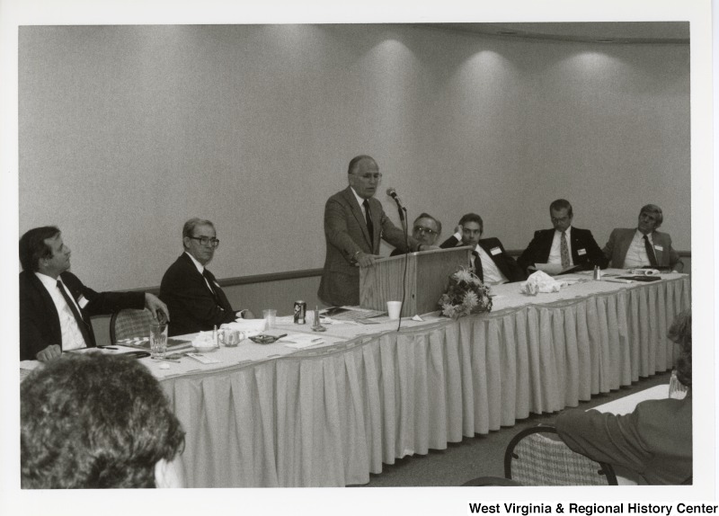 An unidentified man speaking at an Economic Development Seminar attended by Congressman Nick Rahall in Bluefield, West Virginia.