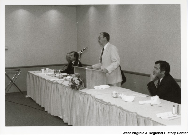 An unidentified man speaking at an Economic Development Seminar attended by Congressman Nick Rahall in Bluefield, West Virginia.