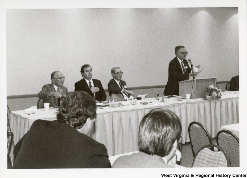 An unidentified man speaking at an Economic Development Seminar attended by Congressman Nick Rahall in Bluefield, West Virginia.