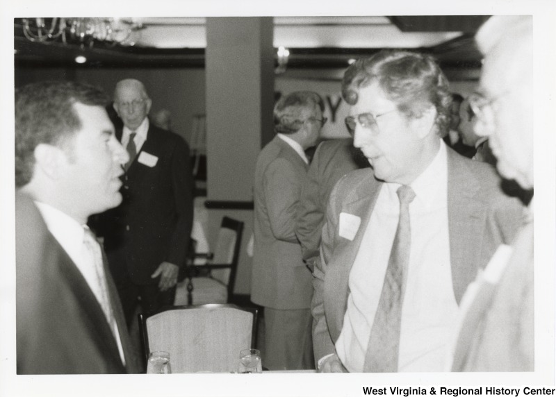 Congressman Nick Rahall speaking with Bob Clark of Ryder Systems, Inc. at a breakfast.