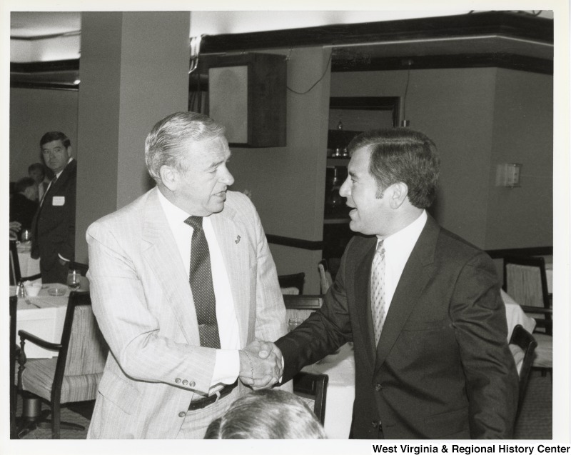 Congressman Nick Rahall shaking hands with Congressman James Howard (D-NJ), Chairman of the House Committee on Public Works and Transportation at a breakfast.