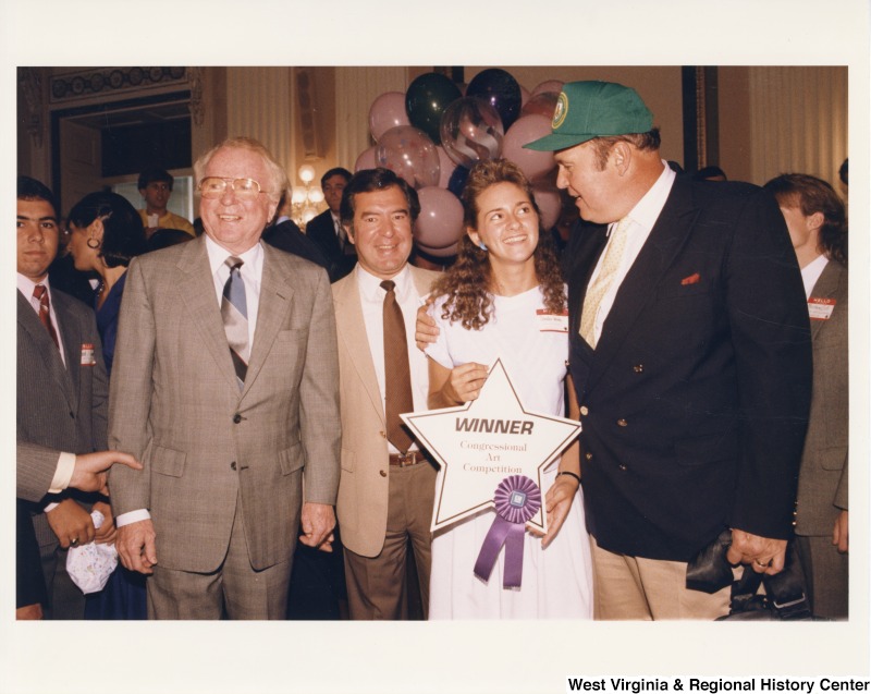 Congressman Nick Rahall with Sandra Weeks, Willard Herman Scott Jr. (American weather presenter) and an unidentified man at a Congressional Art Competition.