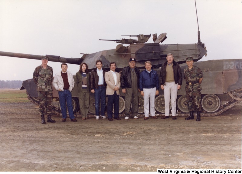 Congressman Nick Rahall with a group of United States Army service members and civilians in front of a tank at Aberdeen Proving Ground.