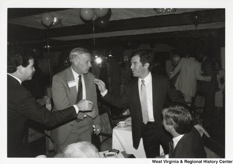 Congressman Nick Rahall mingling with three unidentified men at a Washington, D.C. fundraiser.