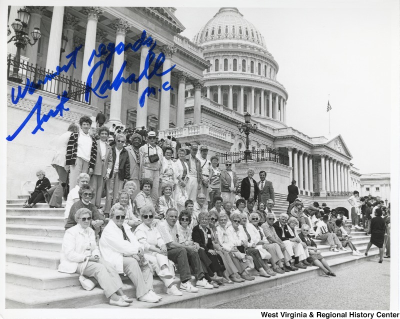 Congressman Nick Rahall with unidentified Beckley Memorial Baptist Church members in front of the United States Capitol building.Photograph is signed: "Warm regards, Nick Rahall."