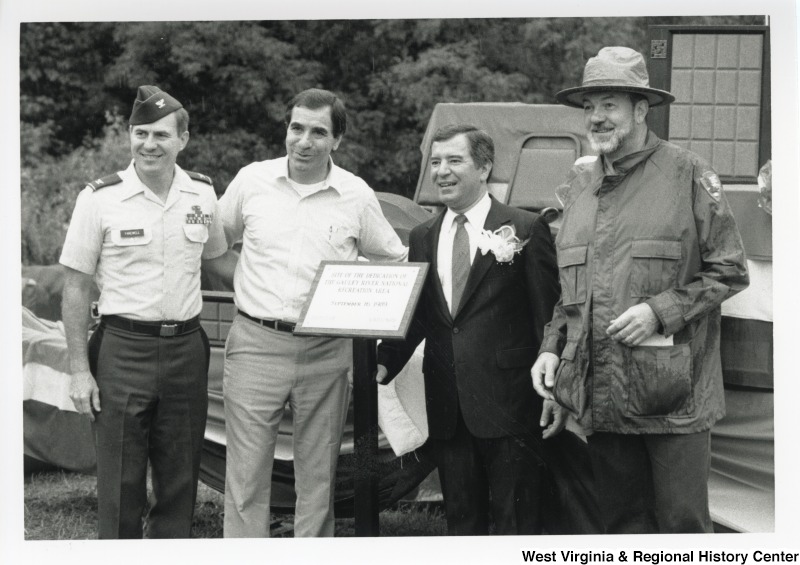 Congressman Nick Rahall with three unidentified men at the Gauley River Recreational Area Dedication.