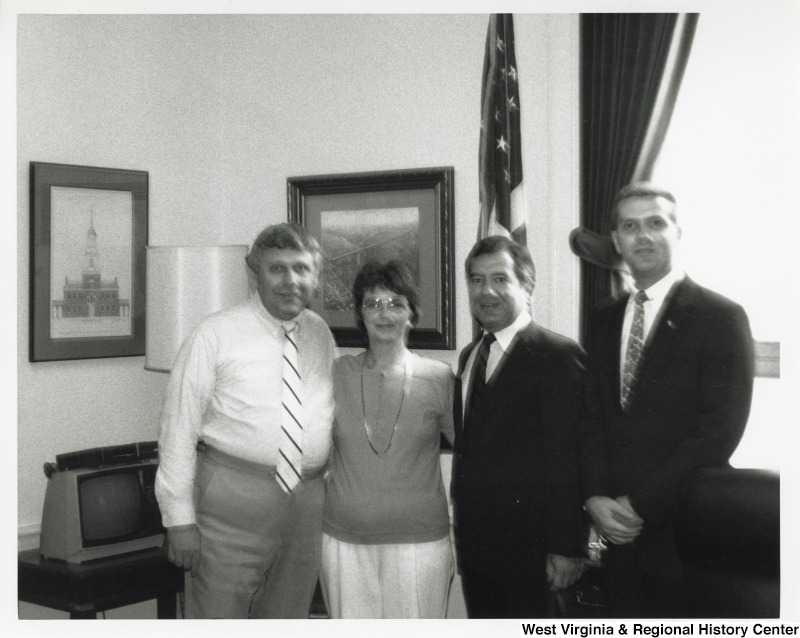 Congressman Nick Rahall with three unidentified people inside his D.C. office.