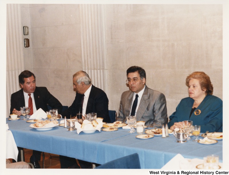 From left to right: Congressman Nick Rahall (D-WV), President of Lebanon Elias Hrawi, an unidentified man, and Congressman Mary Rose Oakar (D-OH) eating dinner at the Baabda Presidential Palace in Beirut, Lebanon.