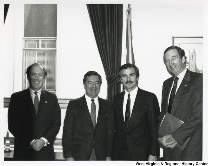 Congressman Nick Rahall with three unidentified men at a Greenbottom Meeting.
