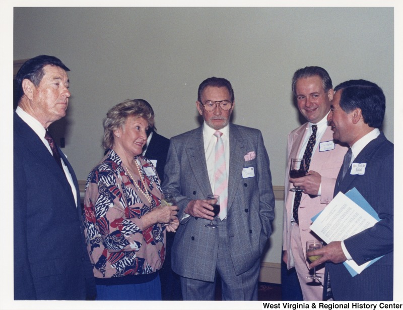 Congressman Nick Rahall (D-WV) with four identified people at a social gathering.