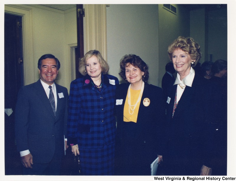 Congressman Nick Rahall (D-WV) with Sharon Percy Rockefeller, Congresswoman Louise Slaughter (D-NY) and an unidentified woman at a social gathering.