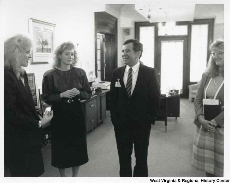 Congressman Nick Rahall (D-WV) with three unidentified women at a BASF Corporation plant in Huntington, WV.