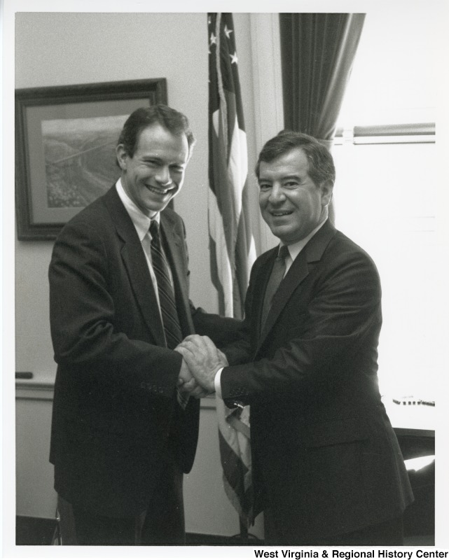 Congressman Nick Rahall (D-WV) with an unidentified man at his United States Capitol office.