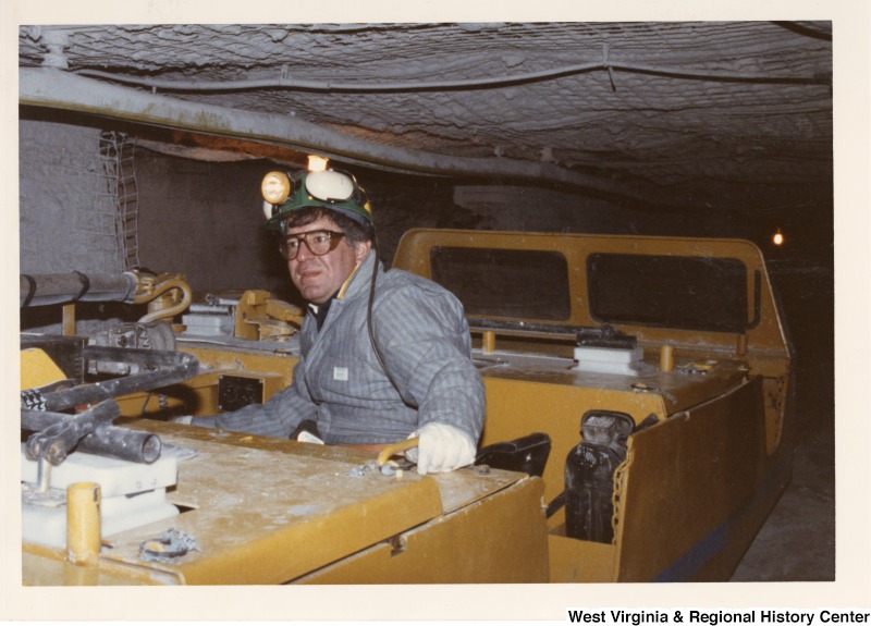 Congressman Nick Rahall (D-WV) in a mine car.