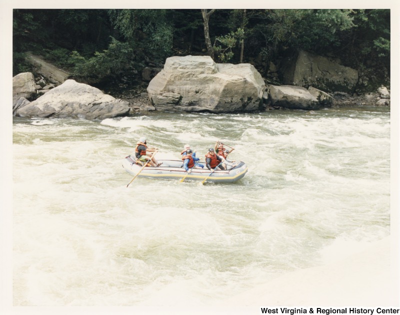 Congressman Nick Rahall (front row far right) rafting on the New River with Manny Lujan (front row far left), United States Secretary of the Interior, and a group of unidentified people.