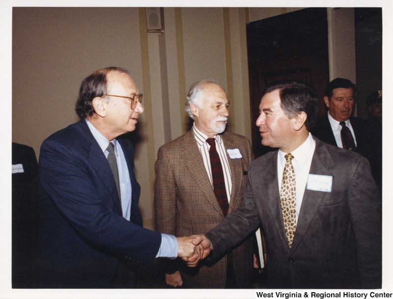 Congressman Nick Rahall (D-WV) shaking hands with Neil Simon, American playwright, screenwriter and author.