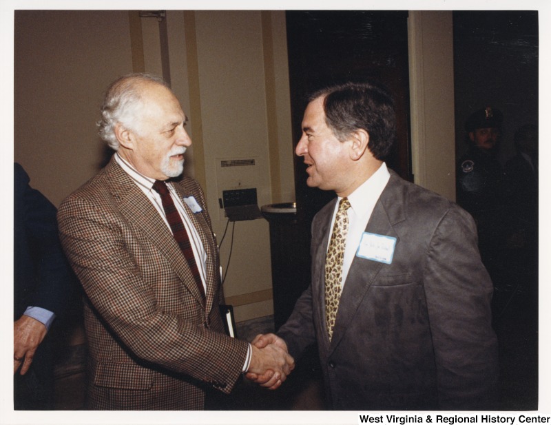 Congressman Nick Rahall (D-WV) shaking hands with an unidentified man.