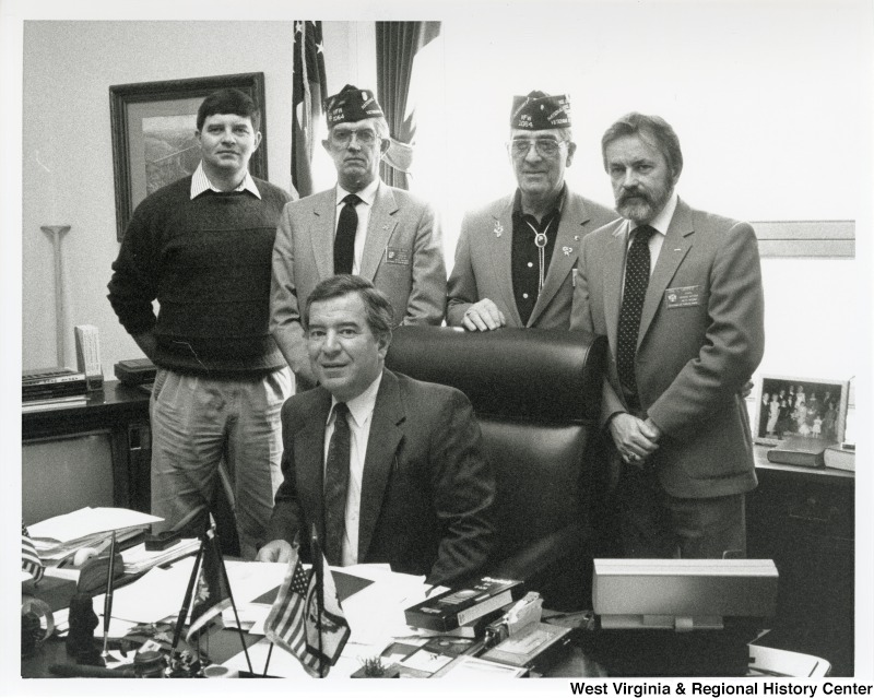 Congressman Nick Rahall (D-WV) with unidentified Veterans of Foreign Wars of the United States. Post 1064 members at office.