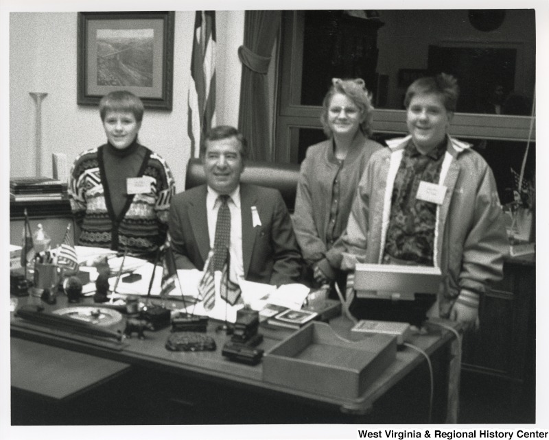 Congressman Nick Rahall (D-WV) with three unidentified children at his office.