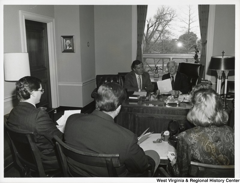 Congressmen Nick Rahall (D-WV), Charles Bennett (D-FL) and three unidentified people at a Champus Bill press conference.