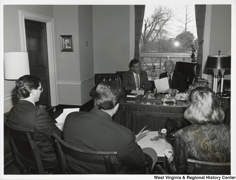 Congressmen Nick Rahall (D-WV), Charles Bennett (D-FL) and three unidentified people at a Champus Bill press conference.
