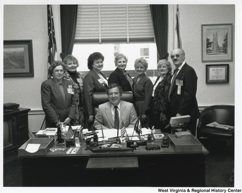 Congressman Nick Rahall (D-WV) with a group of unidentified people at his Huntington office.