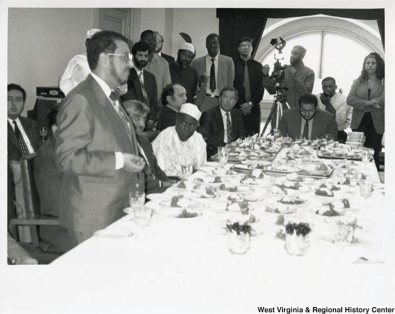 Congressman Nick Rahall (D-WV) at a reception with a large group of unidentified people.