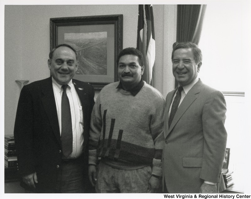 L-R: Sam Kapourales, the President of the Columbian Miners Union, Representative Nick J. Rahall (D-W.Va.)The men stand for a photograph inside an office.