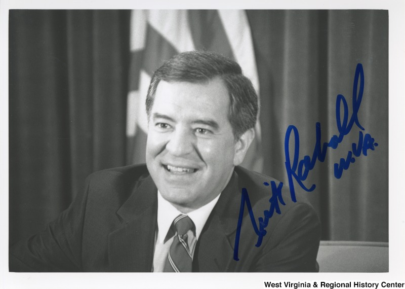 Representative Nick J. Rahall (D-W.Va.) smiles for a photograph. The photograph is signed "Nick Rahall W.VA."
