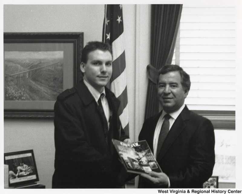 On the right, Representative Nick J. Rahall (D-W.Va.) smiles for a photograph with an unidentified young man from the Close-Up Washington D.C. program.