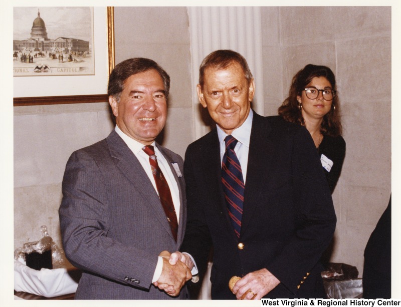 On the left, Representative Nick J. Rahall (D-W.Va.) shakes hands with Tony Randall.